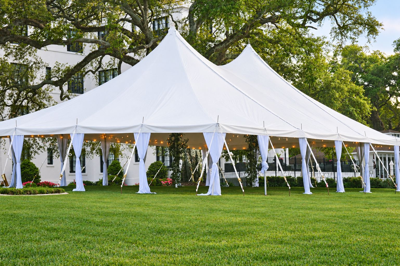 White pole tent with draped legs